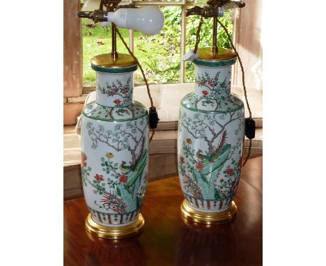 Two Kangxi style Chinese porcelain Rouleau Vases, each hand decorated in enamels in the Famille Vert palette with birds, prun
