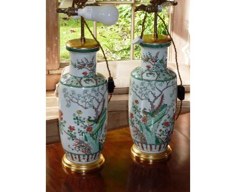 Two Kangxi style Chinese porcelain Rouleau Vases, each hand decorated in enamels in the Famille Vert palette with birds, prun