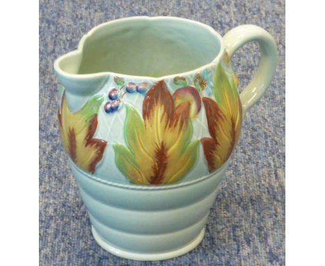 A 1940s Clarice Cliff pottery Jug, the top band decorated in relief with vertical leaves and fruits etc., above a tapering re