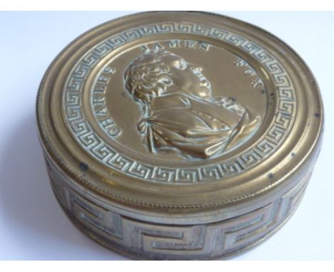 Charles James Fox (British, 1749-1806), commemorative circular brass Snuff Box, the repoussé top decorated with a profile of 