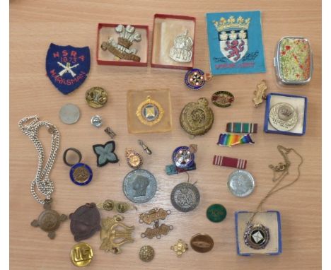 A varied selection of Army Badges and Commemorative Medals and related items to include various Buttons (including one emblaz