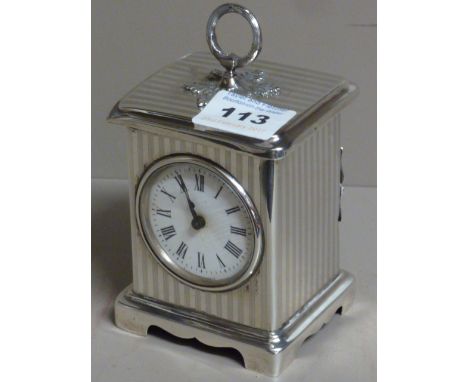 An early 20th century George V silver cased Carriage Clock, the engine linear engraved case surmounted with a silver ribboned