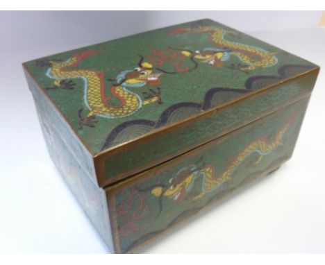 An early 20th century Chinese rectangular cloisonné box with hinged lid, the cover typically decorated with two Imperial yell