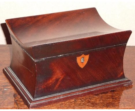 An early 19th century mahogany Caddy of waisted form, shield-shaped boxwood escutcheon, 18.5cm wide    CONDITION REPORT:  Gen