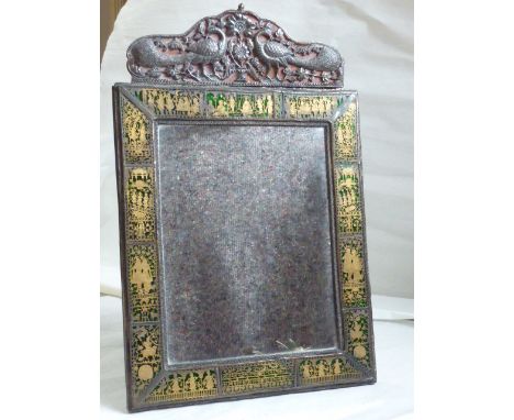An 18th century Mughal Looking Glass, the rectangular frame surmounted with a repoussé silver crest containing two opposing p