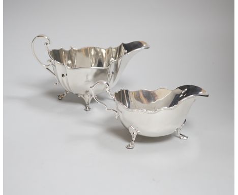 An Edwardian crested silver sauceboat, of lobed form, with scroll feet, makers R &amp; B, Sheffield 1904, 249 grams, and a Ma