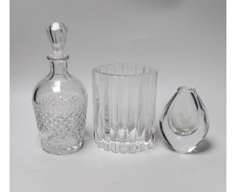 Three pieces of signed glass comprising a Kosa Boda vase by Eden Falk and an Orrefors decanter and vase, the largest 23cm hig