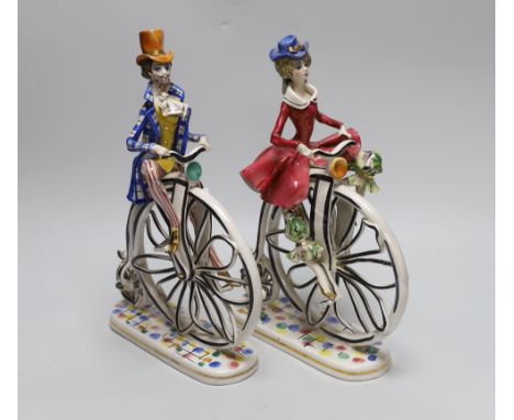 A pair of  1950’s- 60’s Italian ceramic penny farthing cyclists, 31cm
