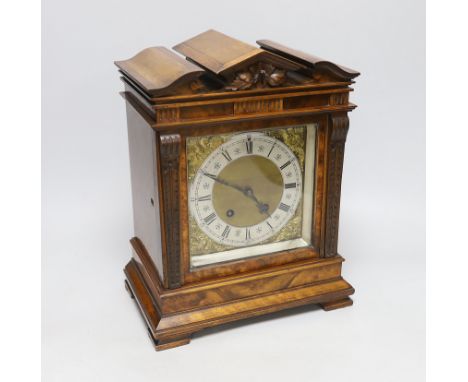 A 19th century walnut and mahogany mantel clock with Black Forest Lenzkirch AUG ‘1 Million’ movement, striking on a coiled go