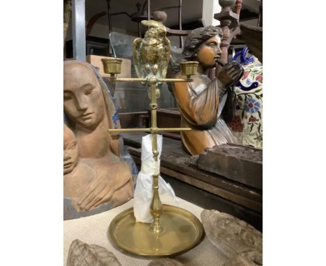 An early 20th century brass parrot on perch two light candelabrum, 33cm high