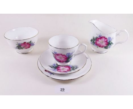 A Duchess floral 1950's tea service : six cups and saucers, six tea plates, one cake plate, milk and sugar.
