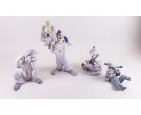 A pair of Nao clown figures and two other clown figures 