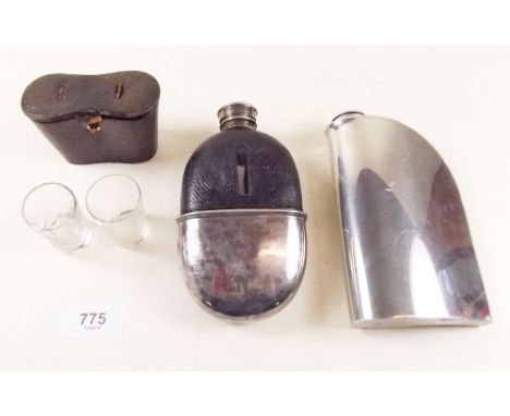 A silver plated and leather spirit flask with two 'tot' glasses, cased and another spirit flask etc.