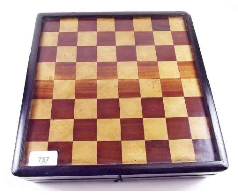 An early 20th century wooden games box with chess board top, backgammon board within and nine man morris to base