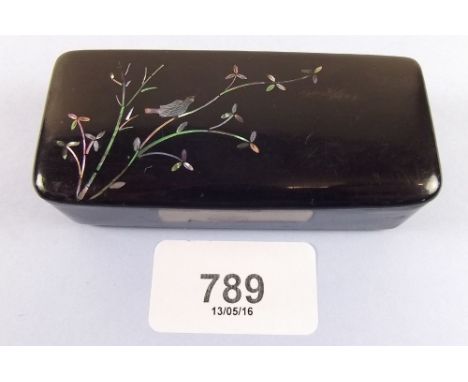 A Victorian papier mache snuff box with mother of pearl inlay bird and branches 