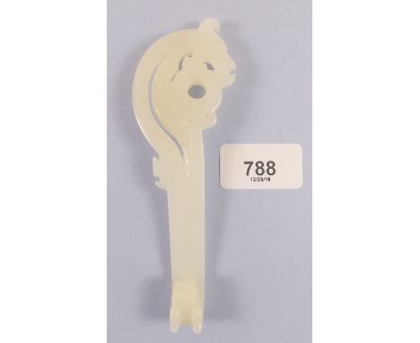 A Chinese 19th century white jade belt buckle in form of a dragon - 14cm