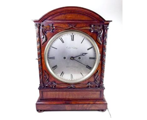 A William IV bracket mahogany clock with arch top case carved foliage and silvered dial, signed Caleb Chitty Kennington, eigh
