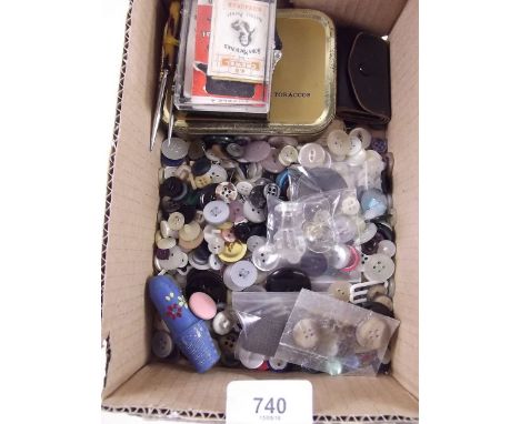 A box of sewing equipment including silver and enamel thimble, buttons etc.