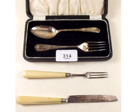 A silver christening spoon and fork, cased - Sheffield 1946 and a Victorian set with ivory handle