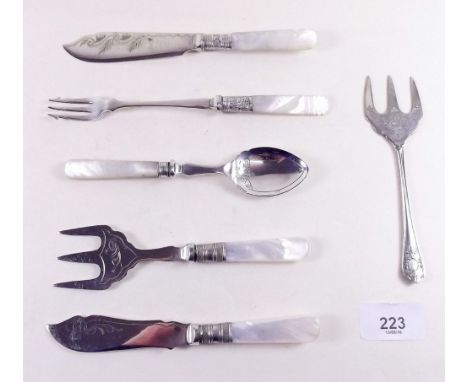 A group of silver plated and mother of pearl cutlery including cake forks, pickle fork, butter knife etc.