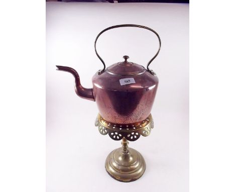 A Georgian brass trivet and a  Victorian copper kettle