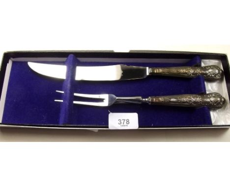 A silver carving knife and fork 