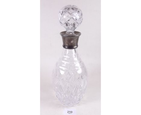 A cut glass decanter with silver collar - Sheffield 1985