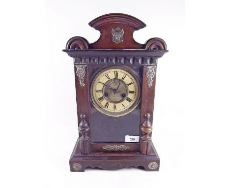 A mahogany finish shelf clock 