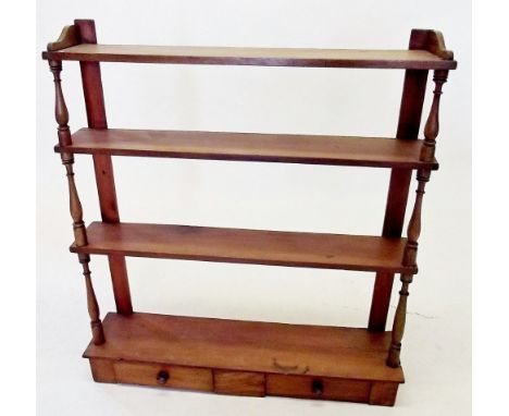 A 19th century pine open wall shelf with two drawers 