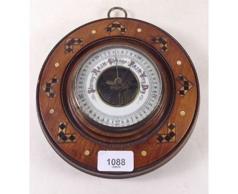An Edwardian inlaid mahogany circular barometer 