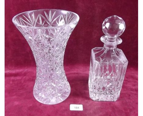 A cut glass decanter and a cut glass vase 