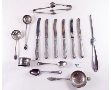 A silver and enamel sifter spoon, six silver handled tea knives, silver sugar tongs and various silver plated cutlery