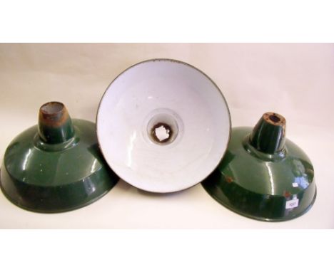 A set of three green enameled industrial lamp shades