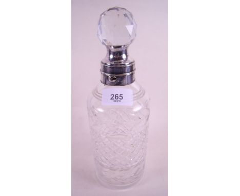 A lockable cut glass decanter with silver plated collar circa 1900 by James Dixon