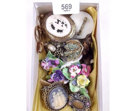 A box of vintage brooches 