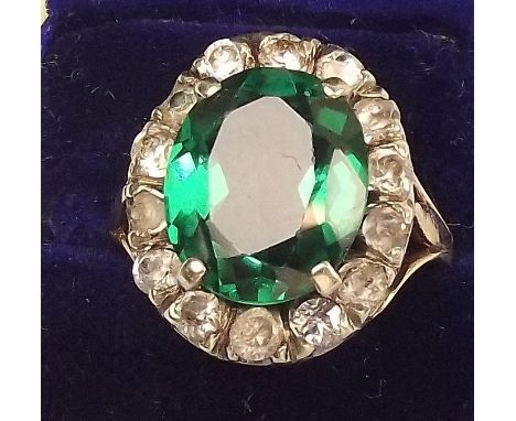 A vintage 9ct gold faux diamond and emerald cluster ring