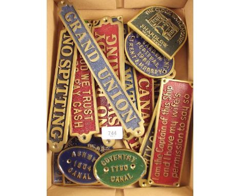 A box of brass and enamel signs, many relating to canals 