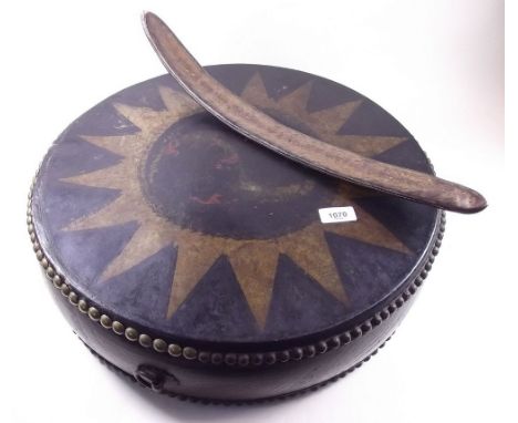 A vintage ethnic folk circular drum painted star and dragon design (faded) and a seed pod rattle 