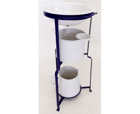 A painted metal washstand with enamel bowl and matched jug and bucket