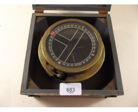 A ships compass in wooden case 