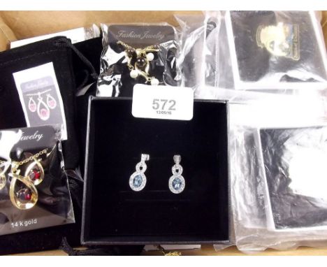 A box of costume jewellery including enamel badges 