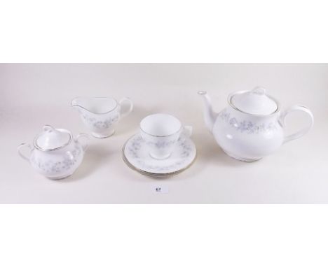 A Royal Vale tea service comprising: teapot, jug, sugar, six cups and saucers, six tea plates and cake plate