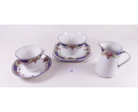 A 1930's tea service with printed borders 'Forestic' comprising:- six cups and saucers, jug, sugar, six tea plates and cake p