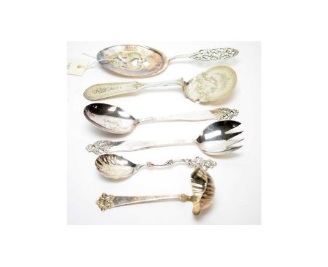 A Dutch silver tartlet slice; another 830 standard silver tartlet slice; a Norwegian silver spoon by Th. Marthinsen; an 830 s