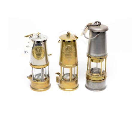 The Wolf Safety Lamp brass and white metal miner's lamp; together with two Eccles miner's safety lamps. (3)