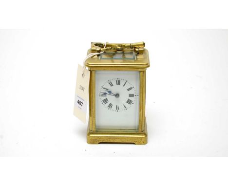 A 20th Century French brass cased carriage clock, the Roman dial with numerals in black, platform lever escapement, 15cms hig
