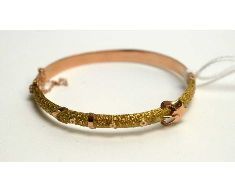 An Edwardian 9ct yellow gold bangle, of beaded buckle design, 7.2g. 