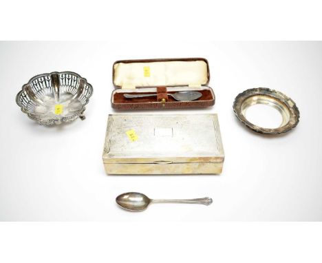 A silver mounted cigarette box; a shaped circular bonbon dish; two silver teaspoons, and a dish stand.