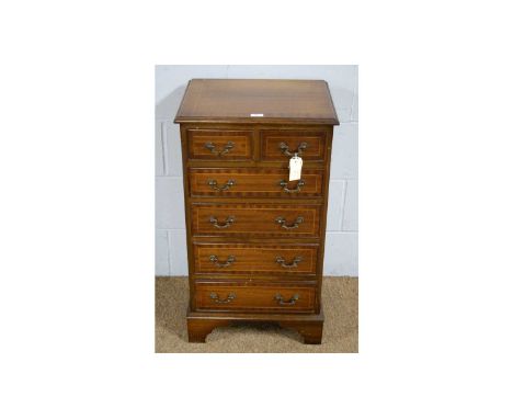 A small reproduction mahogany chest in the Georgian style, the rectangular moulded top above two short and four long drawers,