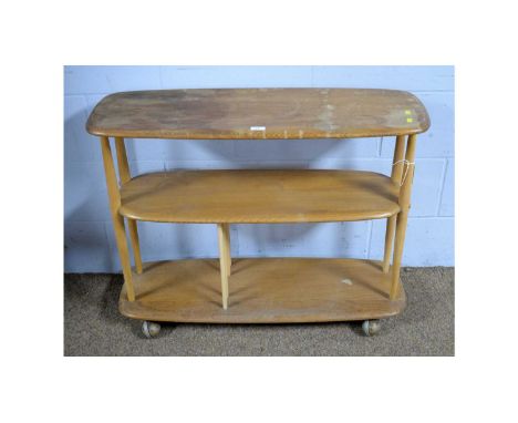 Ercol: a Windsor Model 361 beech and elm bookcase trolley, 90 x 32 x 71cms high.